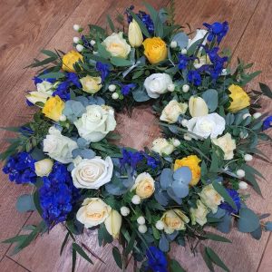Wreath mixed seasonal flowers and foliage